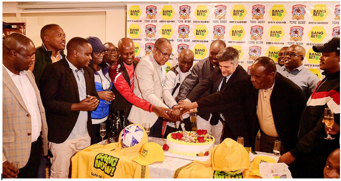 Bangbet vs Shabana launch. All senior management present cut and share cake in celebration.