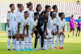 The Black Queens team posing for a group photo before a match.