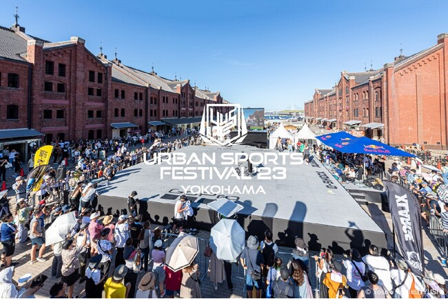 "Outdoor urban sports festival with a large crowd."