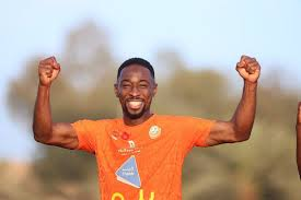 "Black Stars player celebrating during training"
