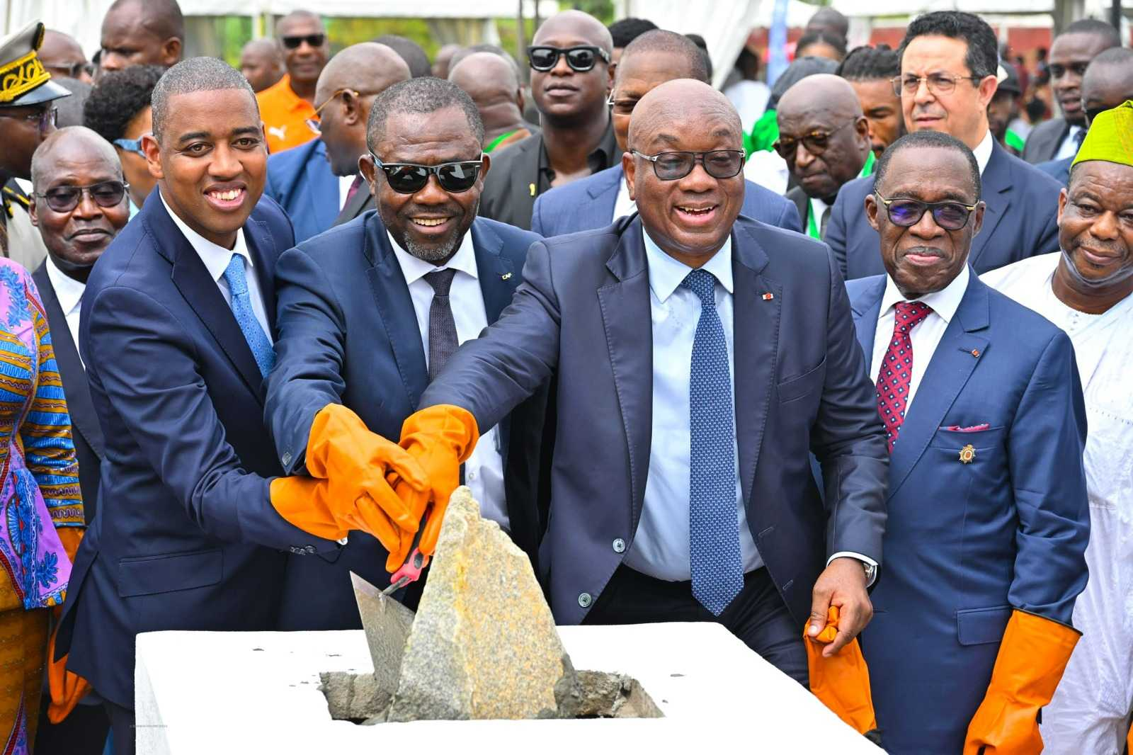"Dignitaries laying foundation stone at FIFA project ceremony"