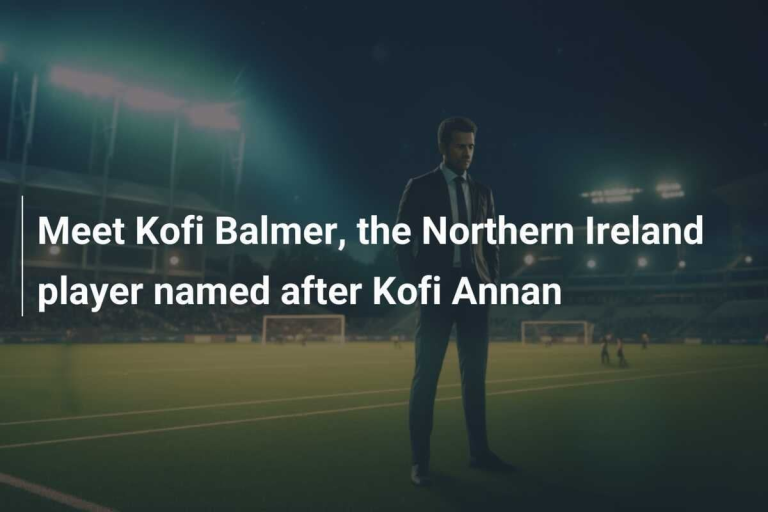 Football player standing on a brightly lit field at night."