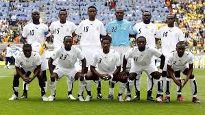 "Ghana national football team posing for a group photo before a match."
