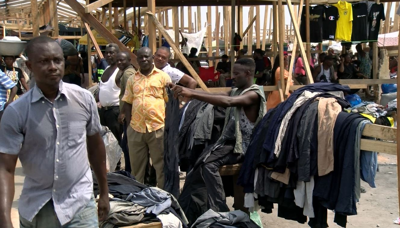 Traders at Kantamanto Market sorting through salvaged goods after the fire
