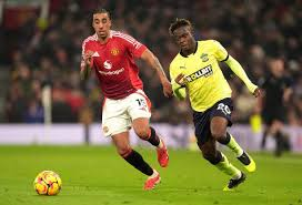 "Manchester United player in action during a match"