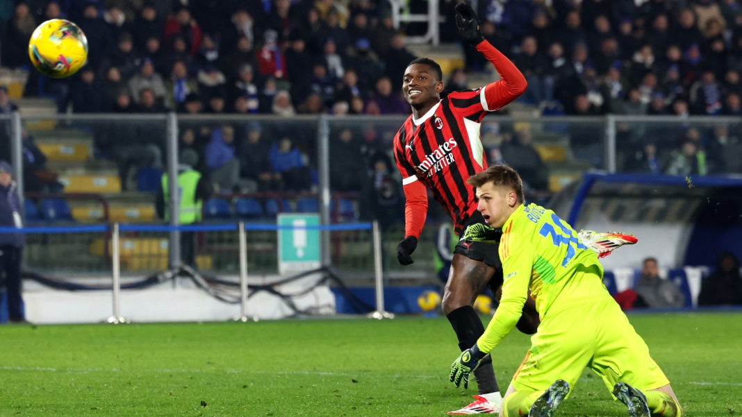 AC Milan player scoring a goal against Como during a match.