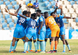 Nations FC players celebrating together during a match