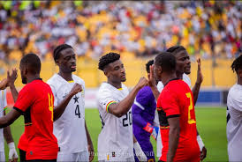 "Players from FC Samartex and Hearts of Oak exchanging greetings before a match."