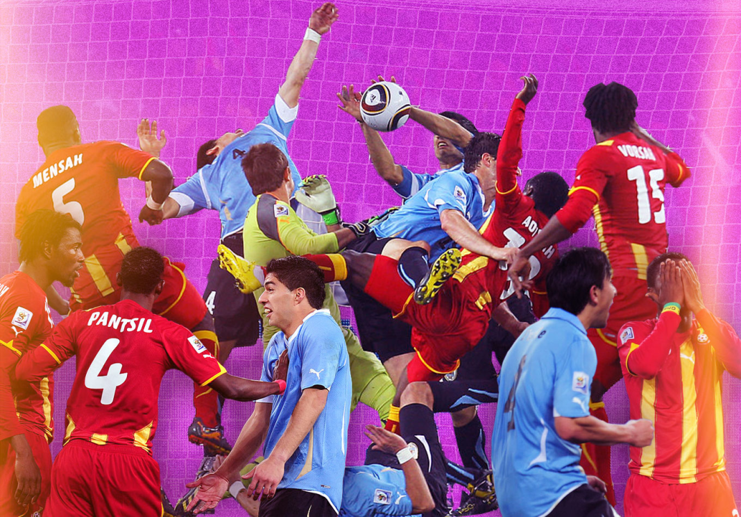 Intense action during a football match with players competing for the ball in the penalty area.