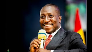 A tribute jersey with Nana Pooley printed on the back and a man in a blue suit.