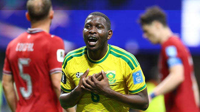 players celebrate a goal during a FIFA World Cup 2026 match. 
