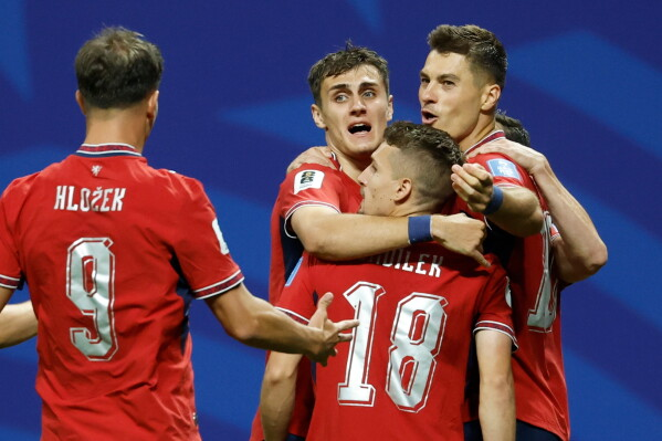 Czechia players celebrate a goal during a FIFA World Cup 2026 match. 
