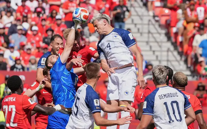 Bosnia and Herzegovina players challenge for a header during the FIFA World Cup 2026 match against Switzerland