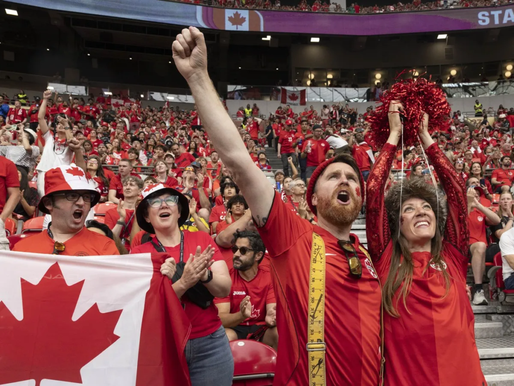 Canada fans celebrate during Canada's dominant 6-0 victory over Qatar