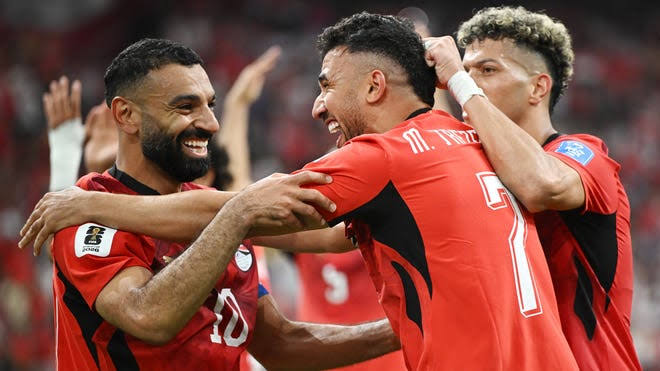Saudi Arabia player heads the ball during an international match.