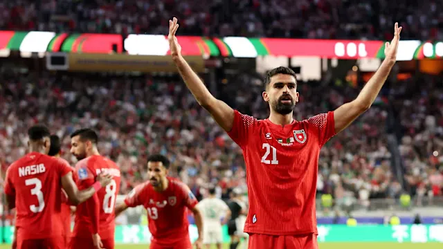 Saudi Arabia captain applauds fans after the match
