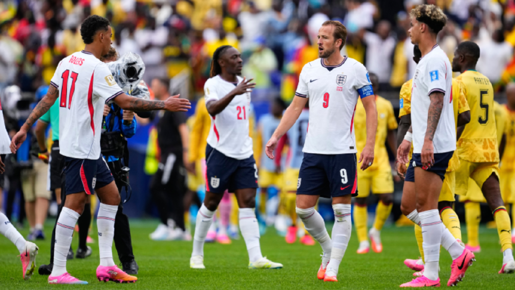 England players celebrate a goal together
