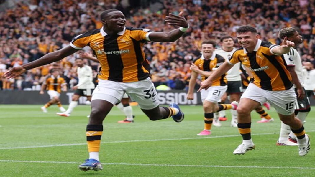 Hull City player Mendy celebrates a goal during a Premier League match against Manchester United.