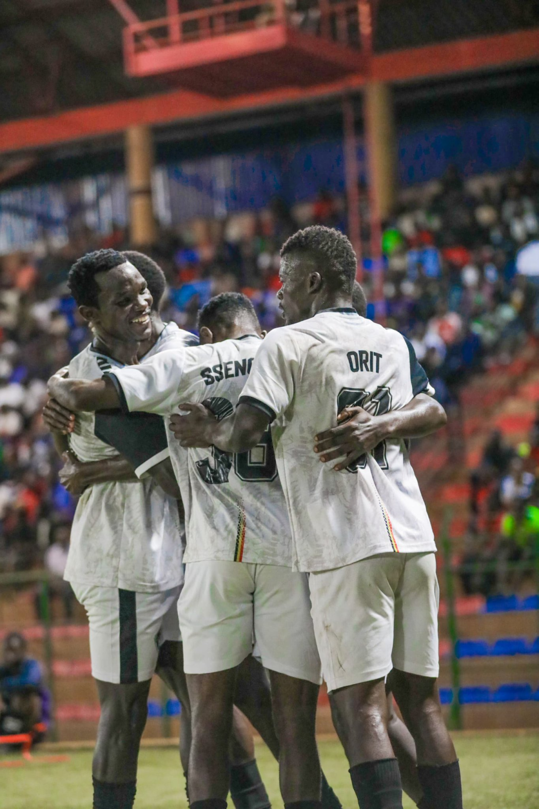 Entebbe UPPC players, including Ibrahim Orit and Sharifu Ssengendo, embrace while celebrating their win against Vipers.