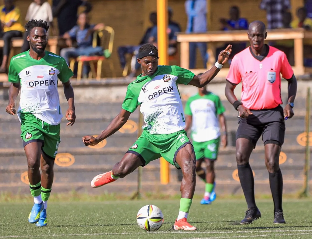 Allan Mugalu controls the ball for NEC while facing KCCA midfielder Brian Jjara.