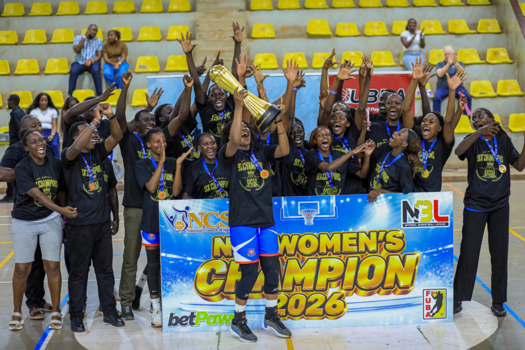 UCU Lady Canons players and staff celebrate their ninth women’s NBL championship with the trophy.