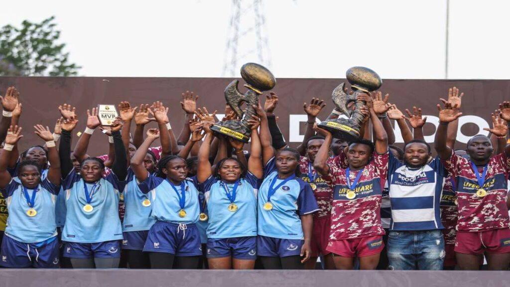 Thunderbirds women and Rams RFC men raise their trophies while celebrating their 2026 Kyadondo 7s victories.