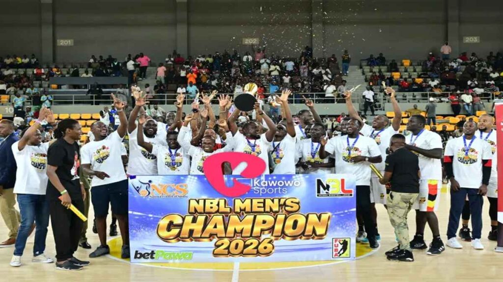 Nam Blazers players and staff celebrate with the 2026 NBL championship trophy after winning the title.