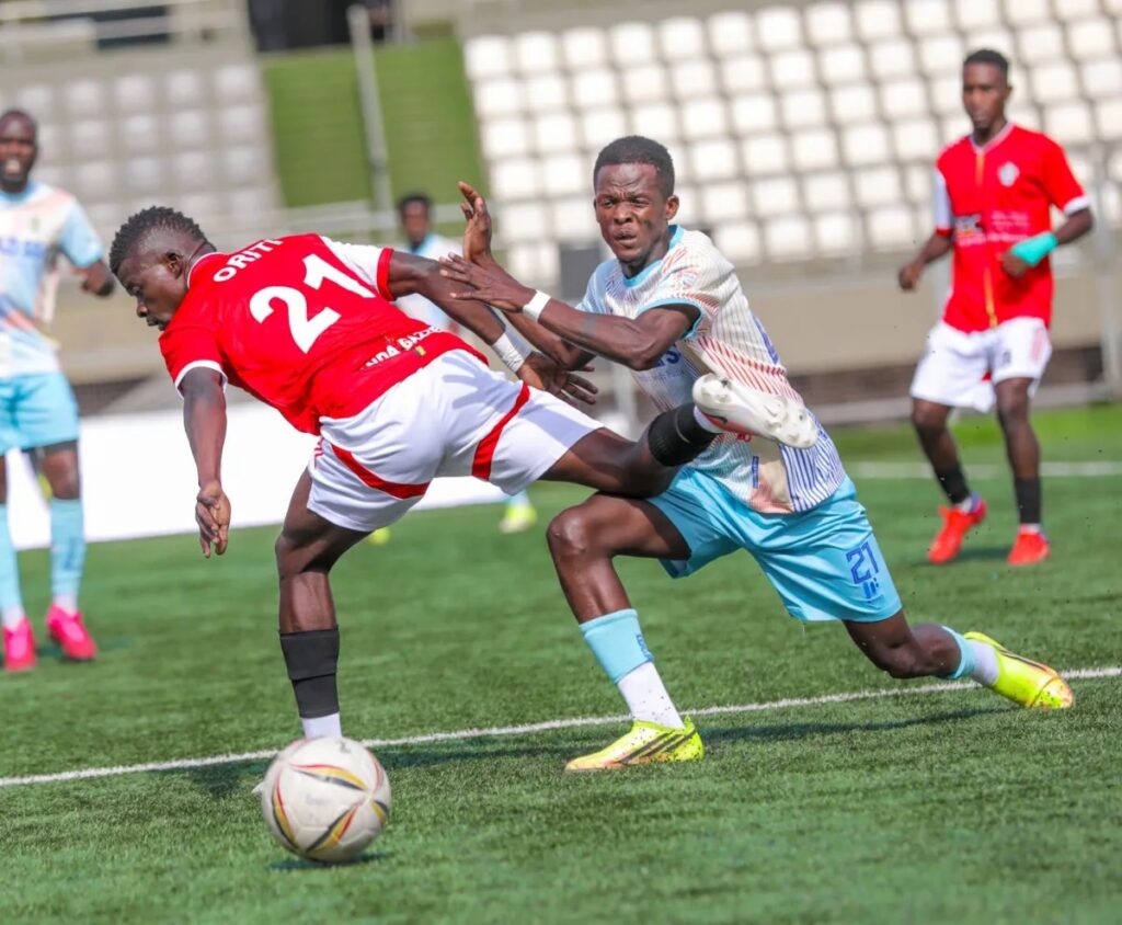 Entebbe UPPC’s Ibrahim Orit challenges Lugazi defender Emmanuel Munoobi for the ball during their UPL match at Hamz Stadium.