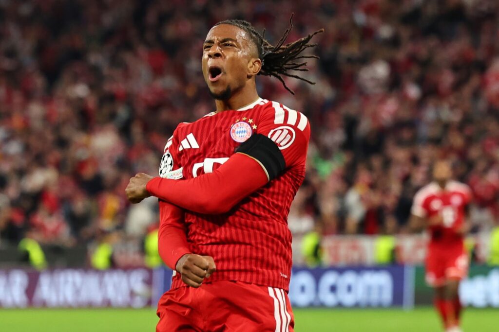 Bayern Munich's Michael Olise clenches his fists and roars in celebration after scoring in the Champions League match against Bodo/Glimt.