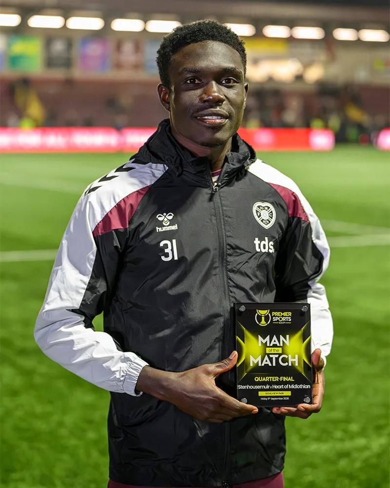 Rogers Mato holds his Man of the Match award following Hearts’ victory over Stenhousemuir.
