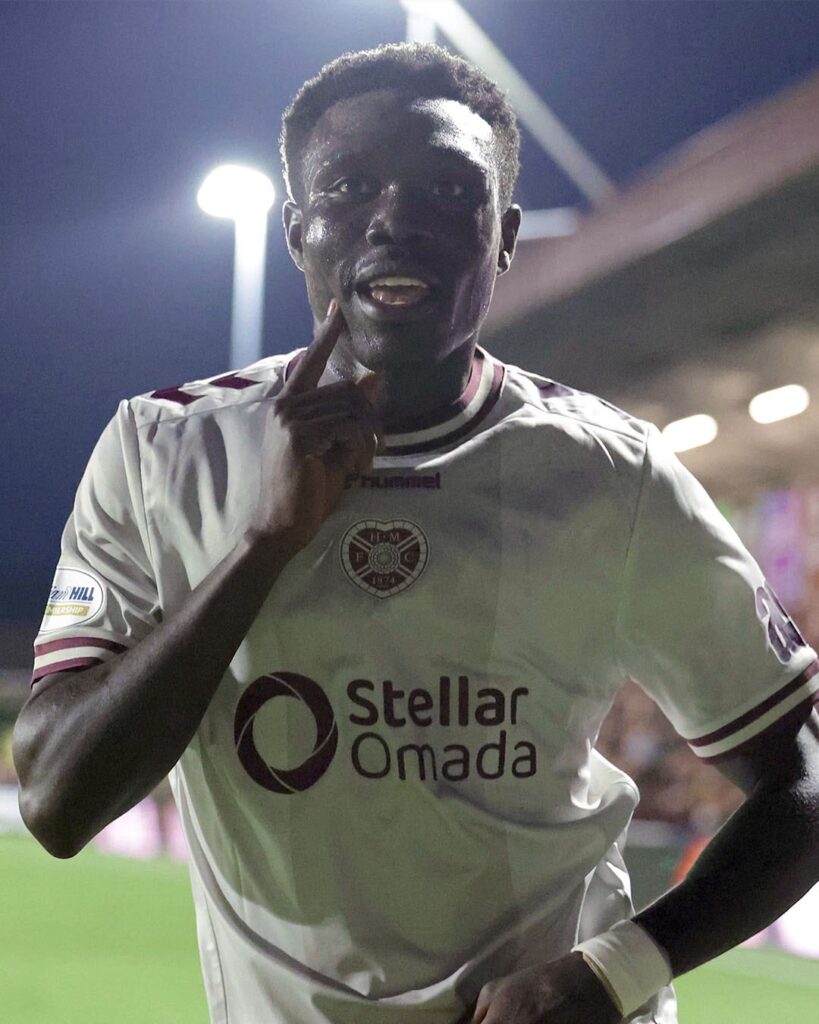 Rogers Mato celebrates in a Hearts jersey after scoring against Stenhousemuir at Ochilview Park.
