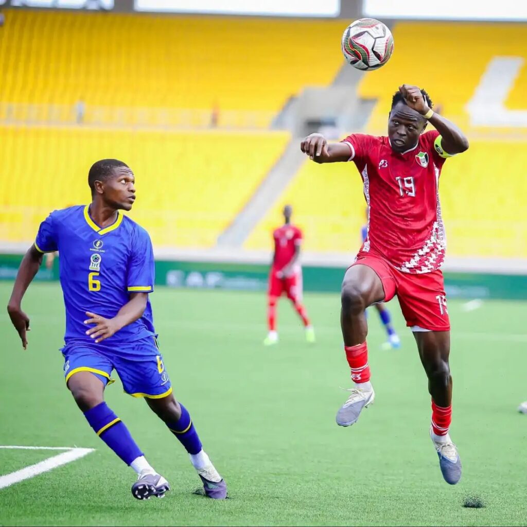 Sudan captain Mazin Fadul Albahli Taowr challenging for the ball against Tanzania's Shomvi Rajabu.