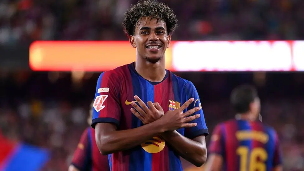 Smiling Barcelona winger Lamine Yamal celebrates his two goals against Rayo Vallecano at Spotify Camp Nou.