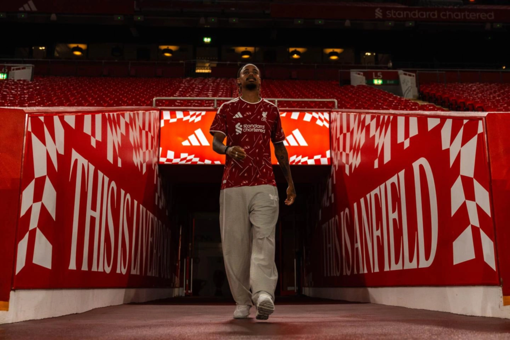 New Liverpool signing Bradley Barcola walks through the Anfield tunnel wearing the club’s red home shirt.