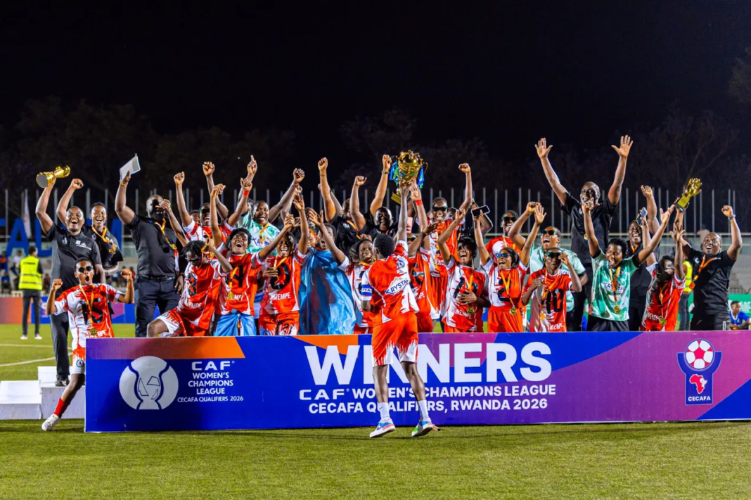 Kawempe Muslim players and coaches lift the CECAFA Women’s Champions League qualifiers trophy during their victory celebrations in Rwanda.