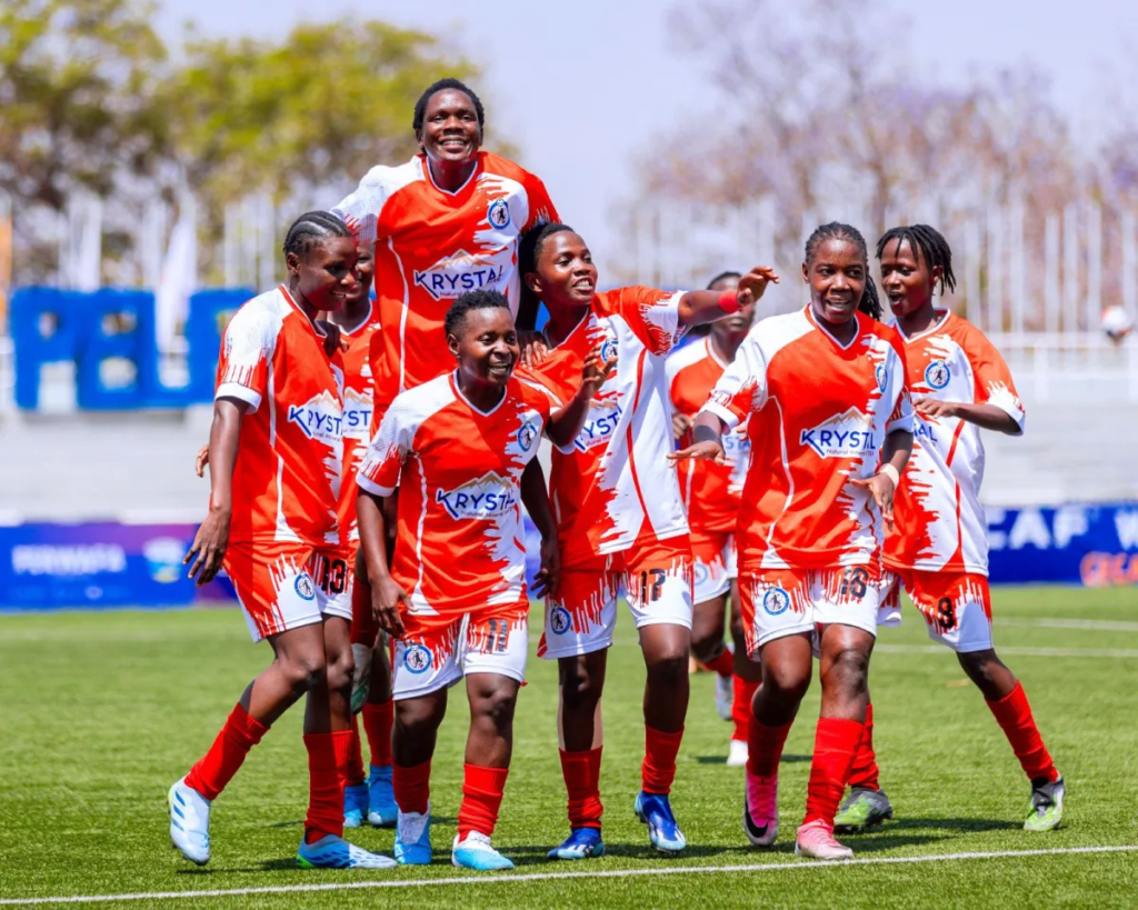 Kawempe Muslim players in red-and-white kits celebrate on the pitch during the 2026 CECAFA Women’s Champions League qualifiers.