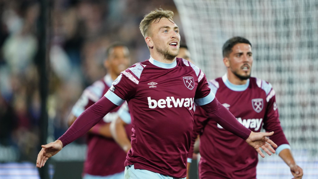 Jarrod Bowen spreads his arms in celebration while wearing West Ham’s claret-and-blue kit.