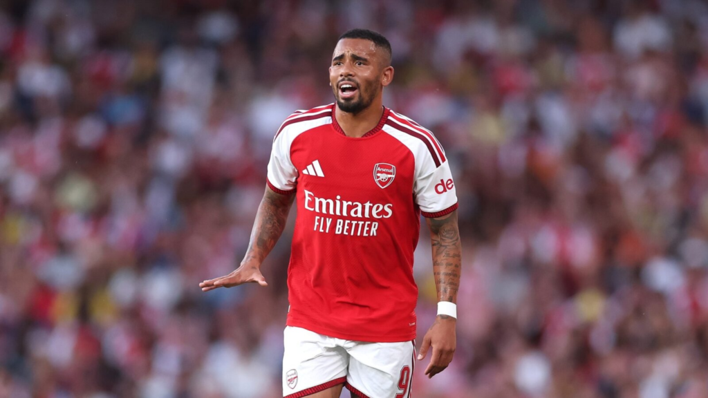 Gabriel Jesus gestures on the pitch while wearing Arsenal’s red-and-white kit.