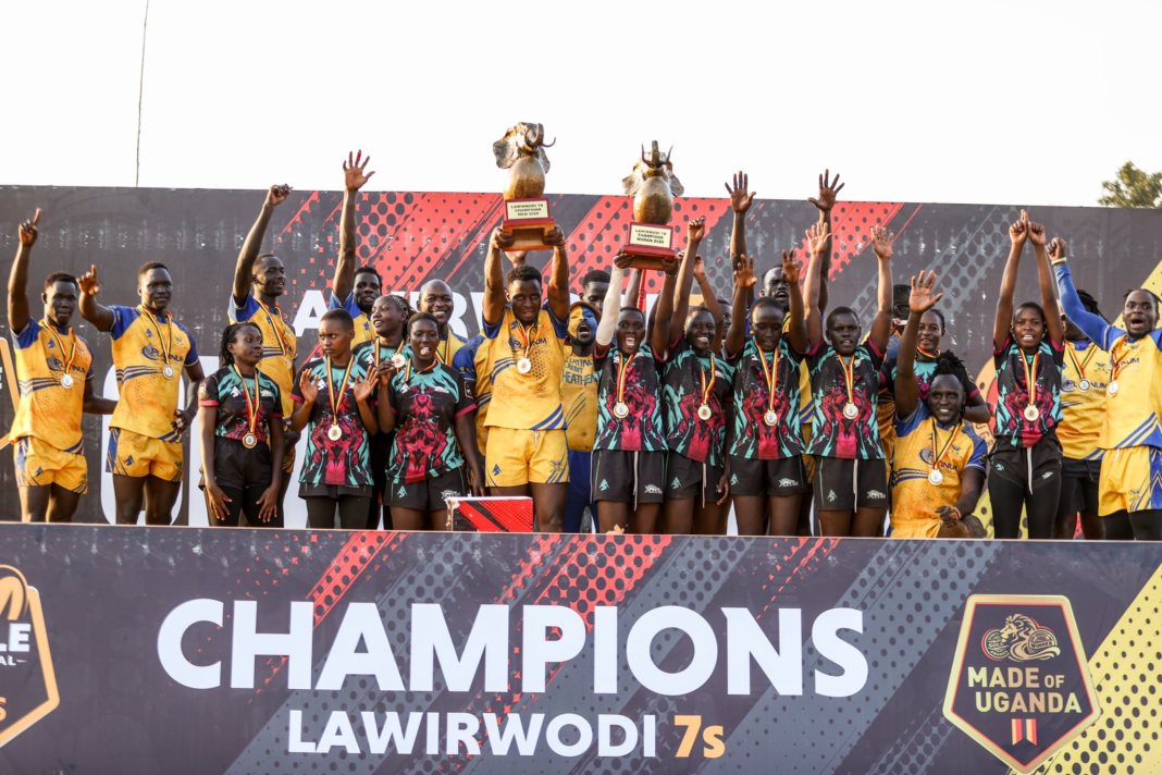 Heathens and Nile Rapids players wearing medals and raising the men’s and women’s Lawii Rwodi 7s trophies on the winners’ podium.