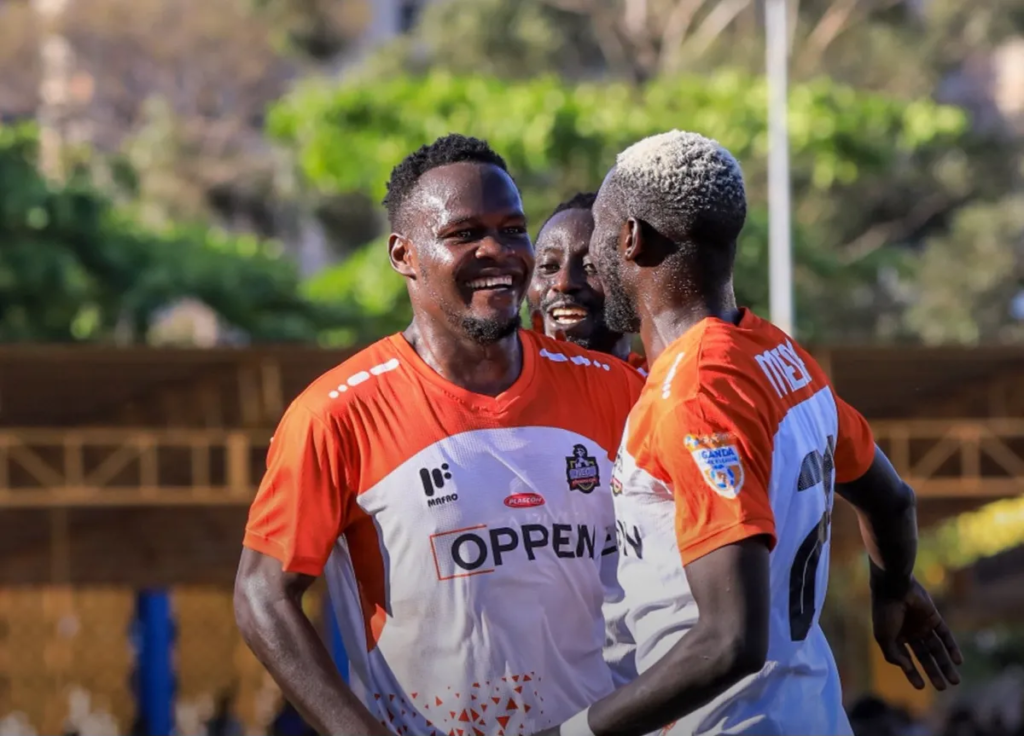 NEC players Richard Basangwa and Ronald Media celebrate together during the Uganda Premier League match against Lugazi FC