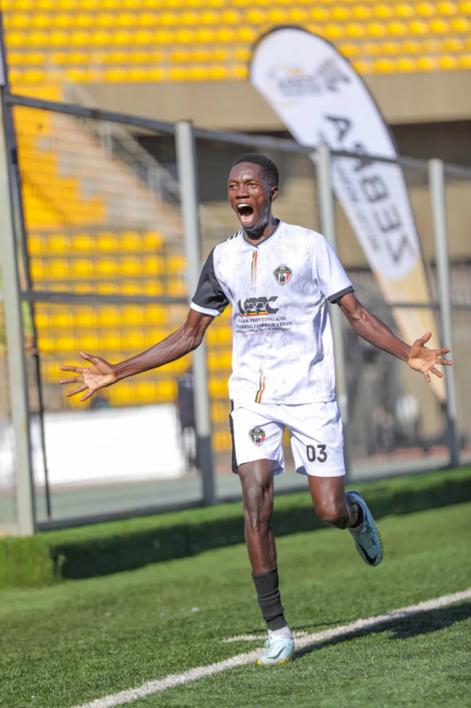 Entebbe UPPC defender Thomas Ochungu celebrates with his arms outstretched during the match against UPDF.
