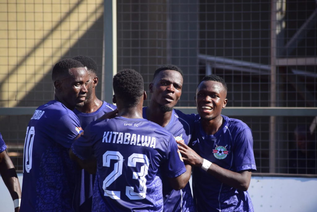 UPDF players celebrate together after scoring during their Uganda Premier League match against Entebbe UPPC.