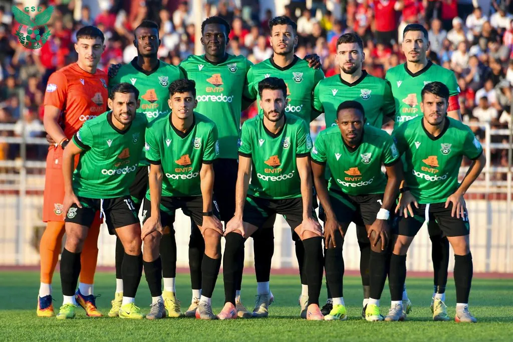 Rogers Torach Ochaki standing third from the left in the CS Constantine starting-team photograph before the match against CR Témouchent.