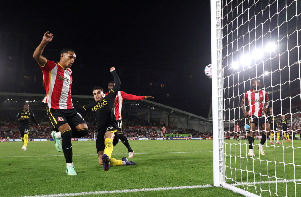 Brentford player Fábio Carvalho celebrating after scoring in injury time to put his side three goals ahead.