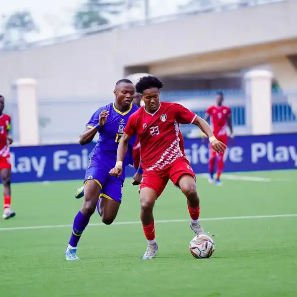 Sudan's Obai Abdalla (No. 23) beating Tanzania's Juma Sagwe during the CECAFA U-20 final at Uhuru Stadium, Dar es Salaam.