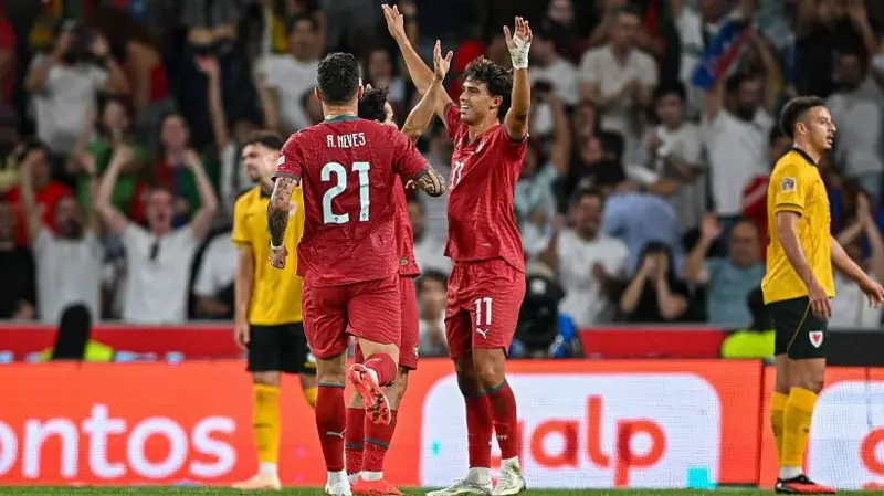 Portugal player João Félix, on the right, celebrating after scoring against Wales.