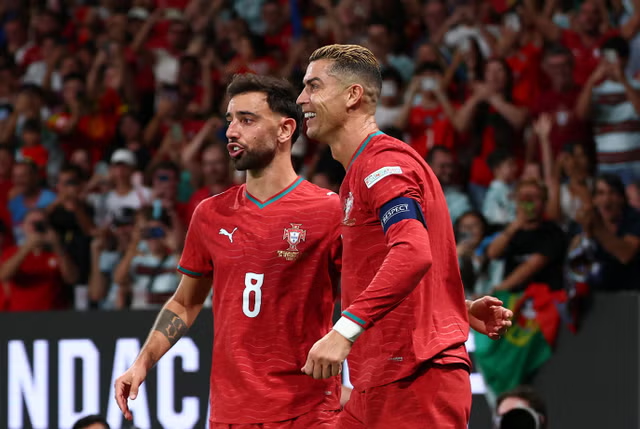 Portugal players Bruno Fernandes and Cristiano Ronaldo pictured together during the match.