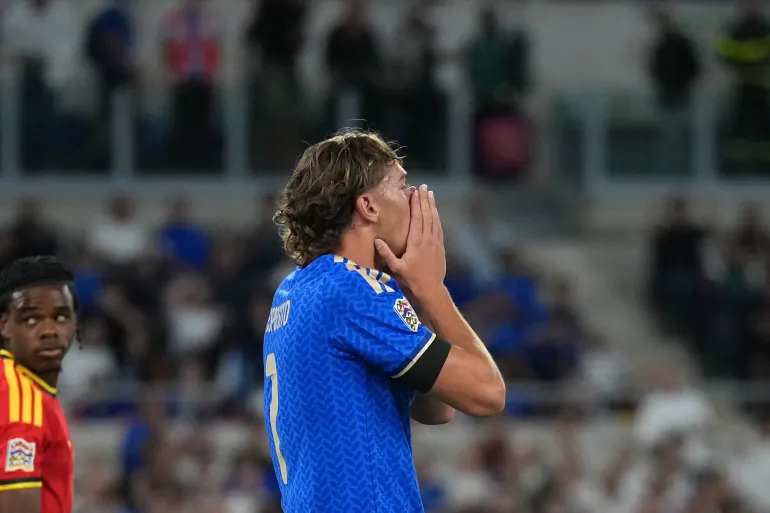 Italy forward Pio Esposito reacting with frustration after missing a scoring chance against Belgium in the UEFA Nations League.