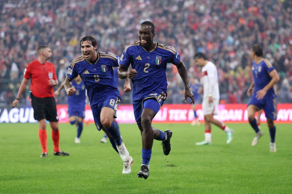 Italy's Michael Kayode celebrating with teammate Sandro Tonali after scoring his team's third goal during the UEFA Nations League match against Türkiye at Atatürk Spor Kompleksi Matli Stadyumu, Bursa.