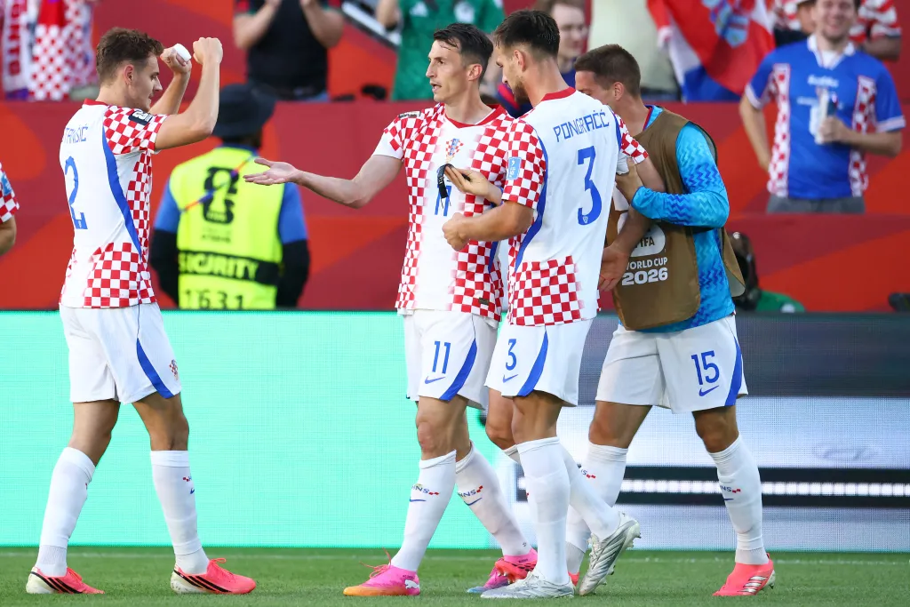 Croatia forward Ante Budimir, wearing No. 11, celebrating with teammates after scoring his team's first goal against Panama at the 2026 World Cup in Toronto.